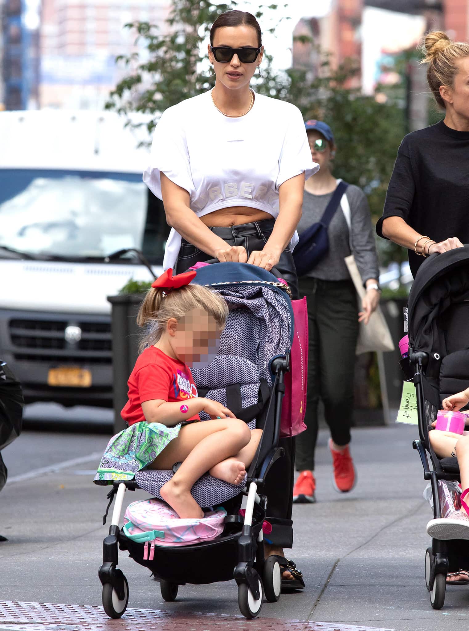 Irina Shayk keeps her off-duty look sleek and minimalist as she pushes daughter Lea’s stroller during a visit to the SlooMoo Institute in New York City on June 23, 2021