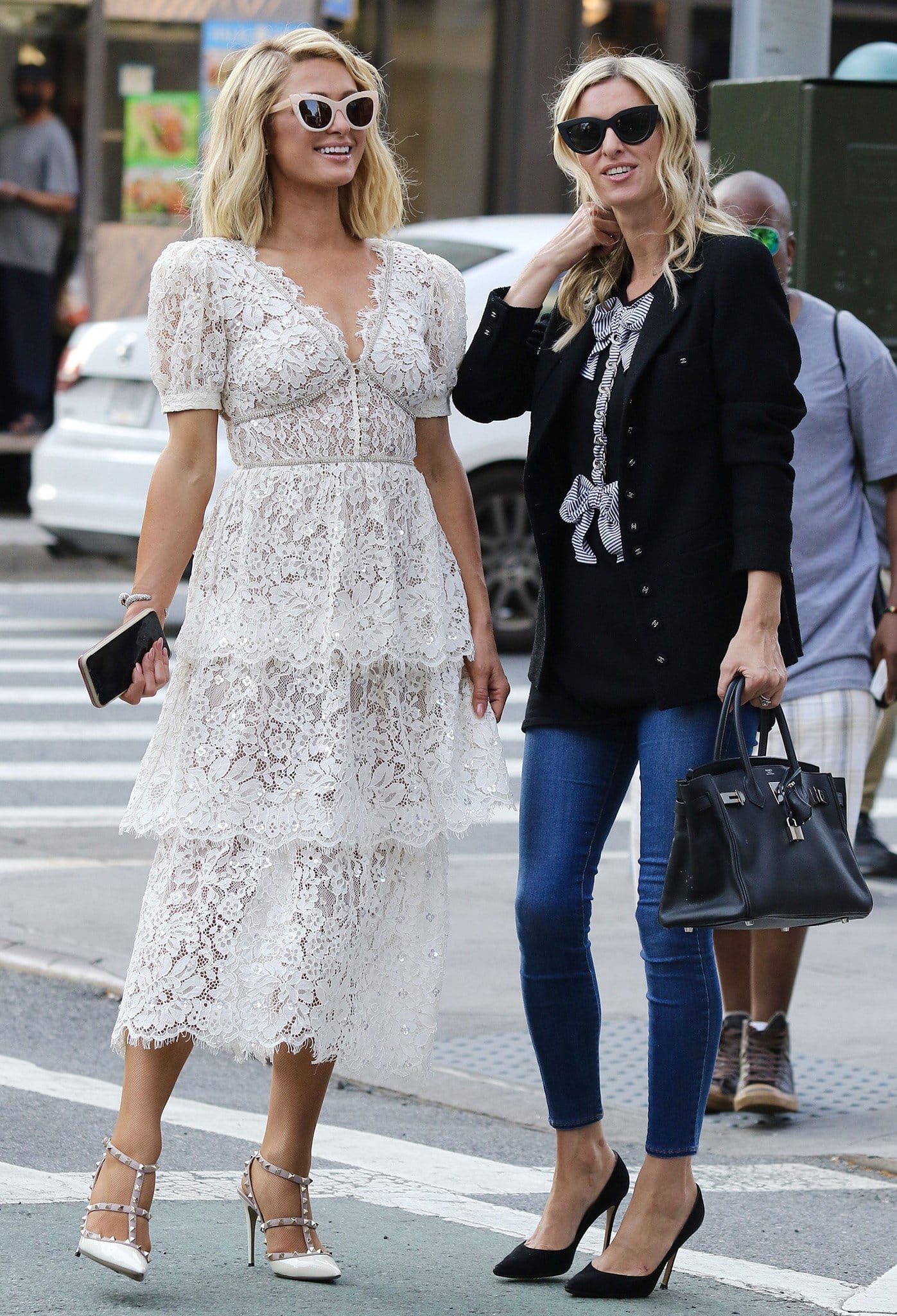 Paris and Nicky Hilton walk together in SoHo in New York City on June 21, 2021