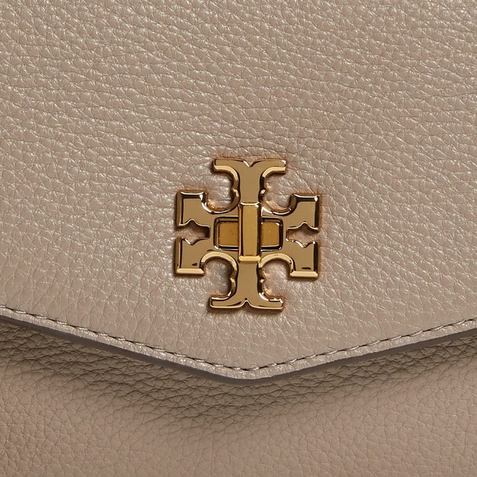 Tory Burch's cross symbol logo is made up of two letters “T” placed one over the other