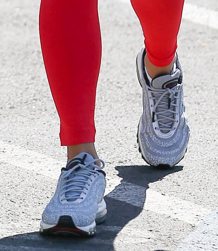 Vanessa Hudgens steps out in Swarovski x Nike Air Max 97 sneakers, their crystal-embellished upper catching the light as she heads out in sporty style