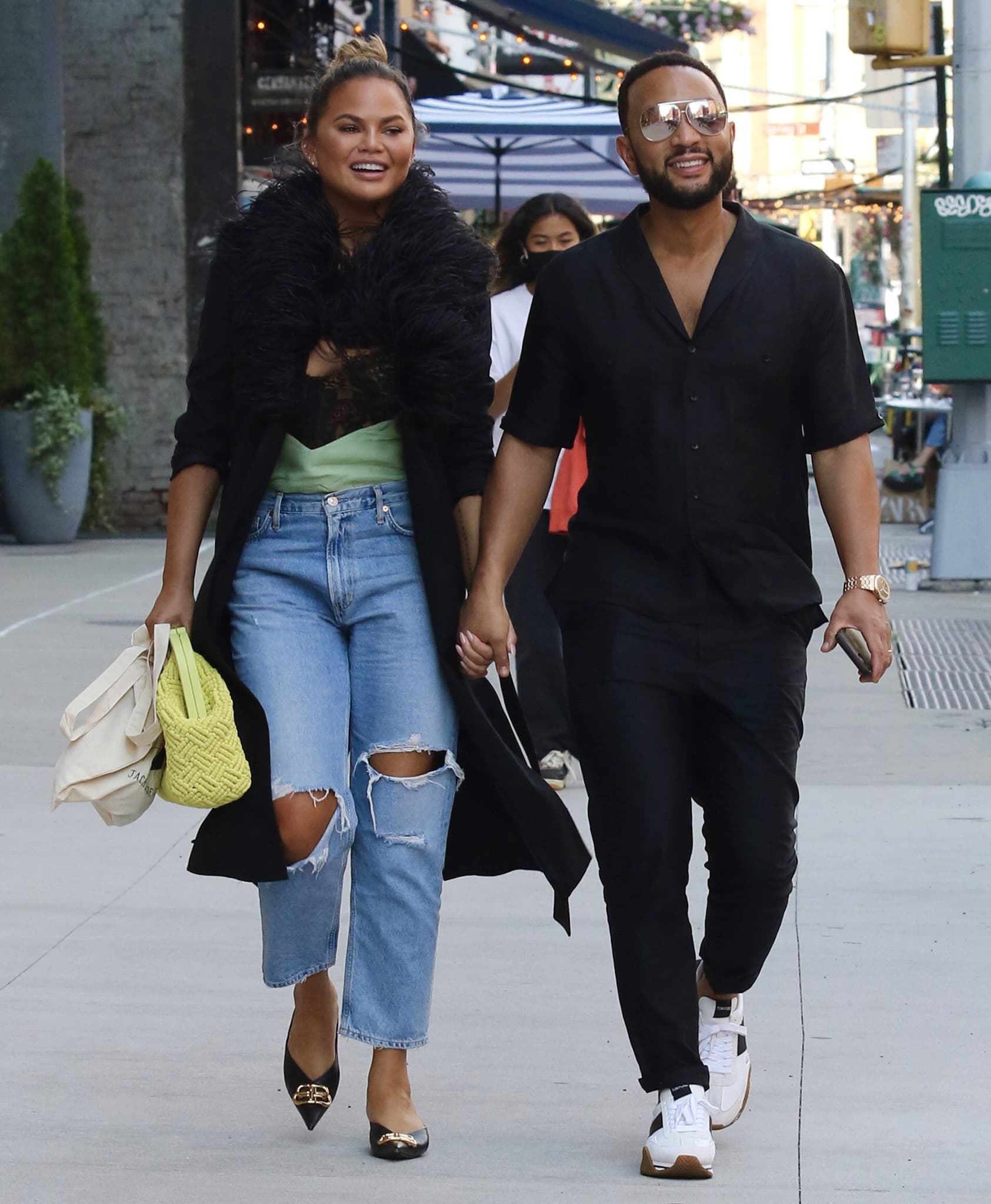 Chrissy Teigen and John Legend step out for lunch in New York City on July 30, 2021, coordinating relaxed off-duty looks with designer footwear at the forefront