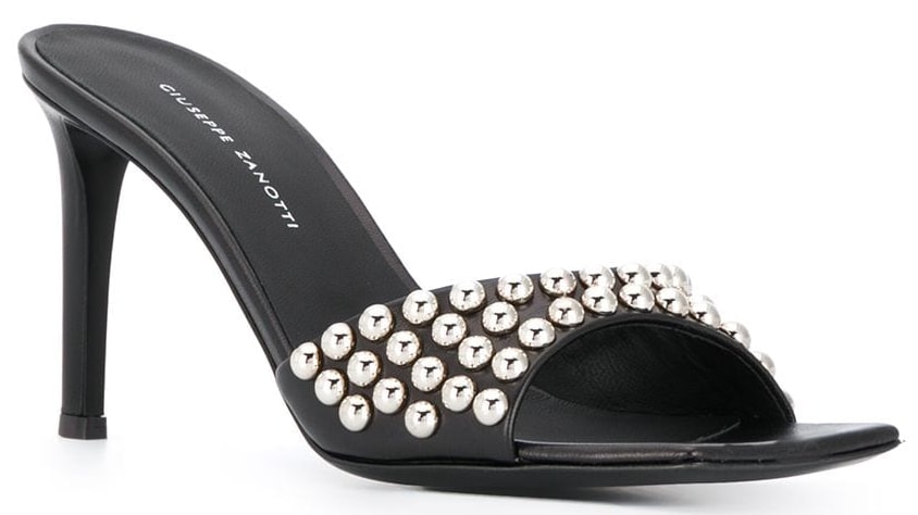 An edgy black Giuseppe Zanotti mule sandal with stud-embellished open-toe straps and mid heels