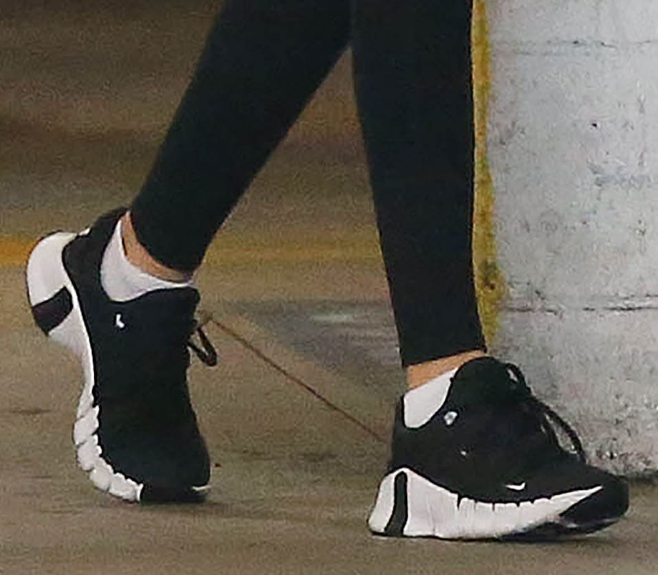 Kaia Gerber grounds her streamlined athleisure look with Nike Free Metcon 4 sneakers, blending flexible comfort with the structured support of a gym-ready silhouette