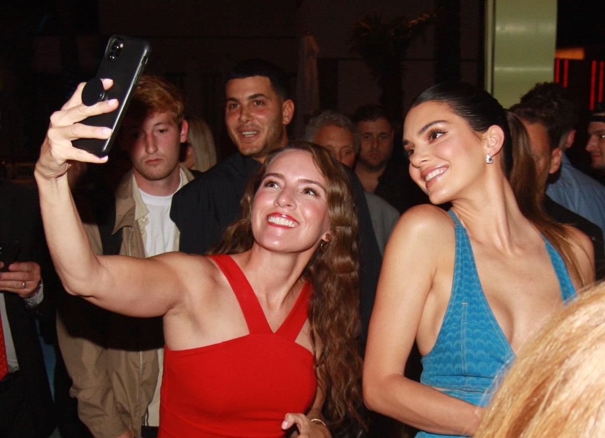 Kendall Jenner flashes a radiant smile while posing with fans during her 818 Tequila launch at the Resorts World Grand Opening in Las Vegas on June 25, 2021