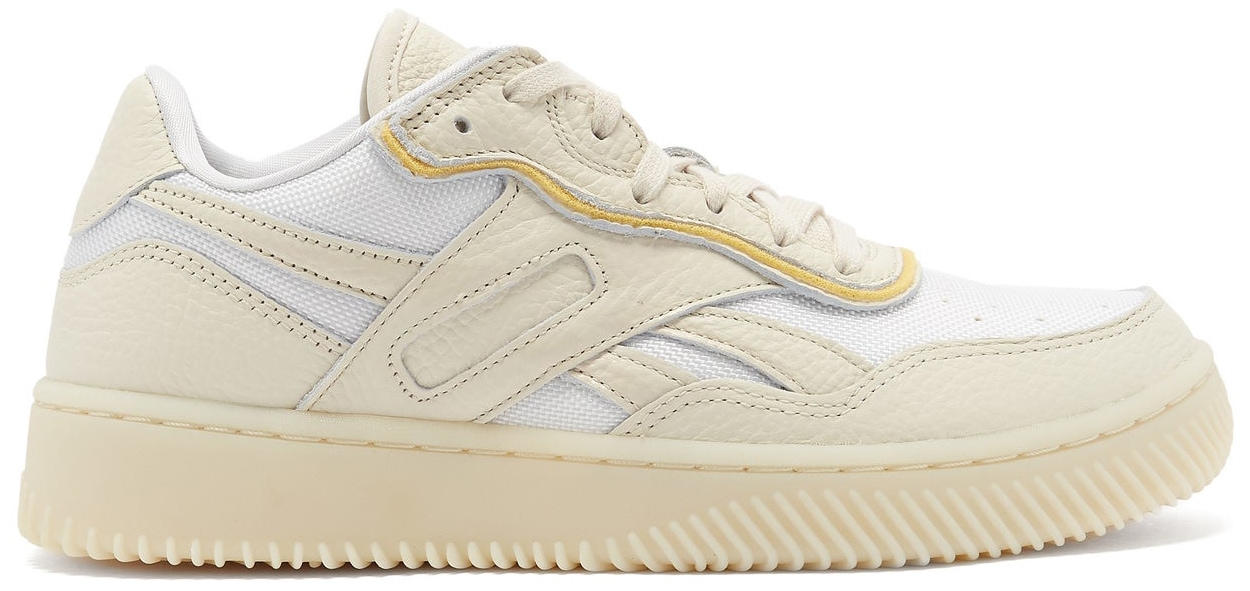 The Reebok x Victoria Beckham Dual Court II reworks classic basketball and tennis silhouettes with layered leather panels, mesh inserts, and a chunky cream sole