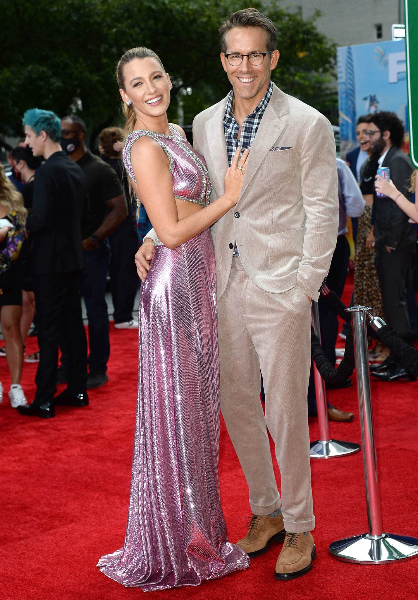 Blake Lively and Ryan Reynolds pose at the Free Guy premiere at AMC Lincoln Square Theater in New York City on August 3, 2021, with her shimmering Prabal Gurung gown skimming the red carpet and subtly concealing the Christian Louboutin sandals anchoring the look