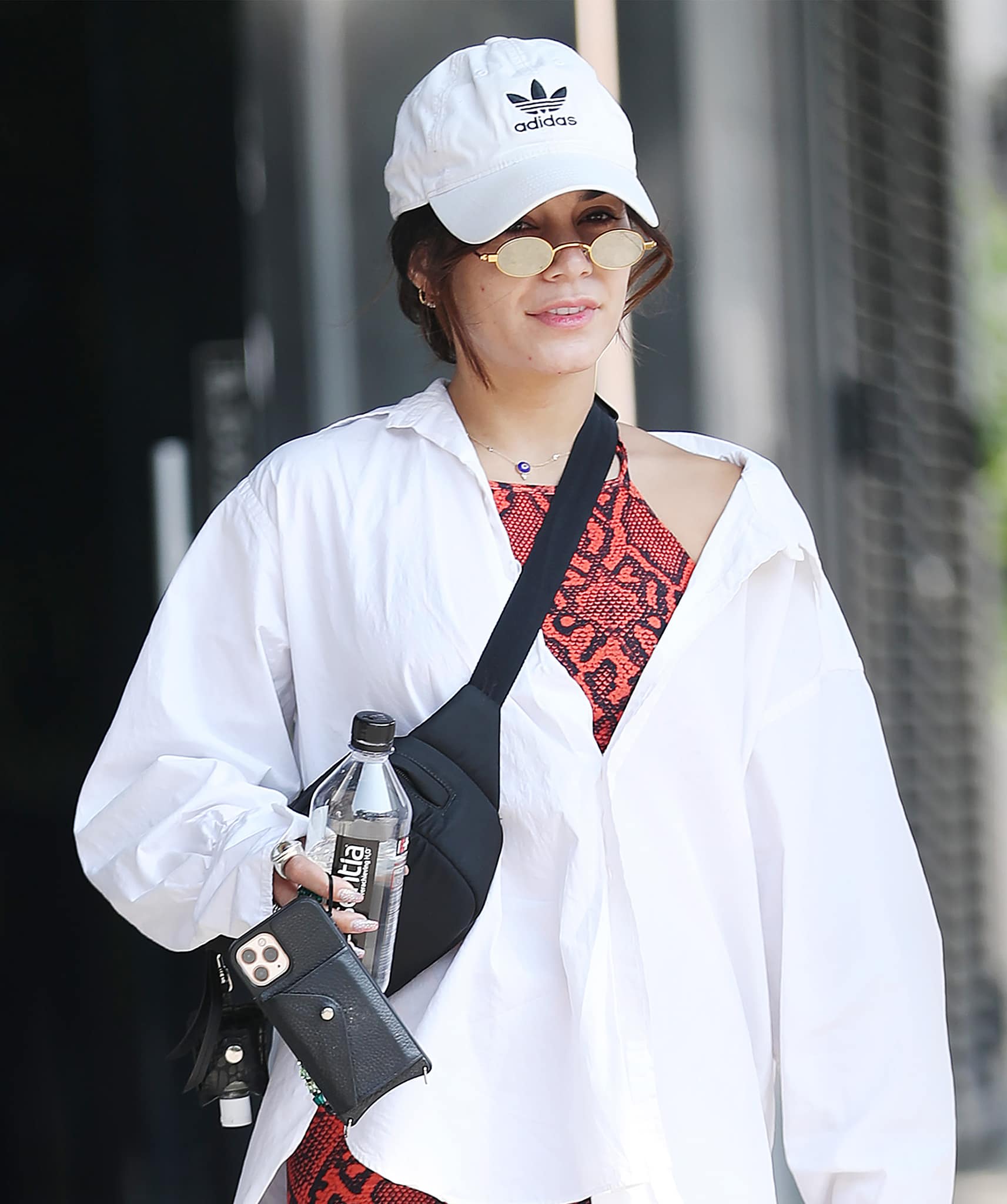 Vanessa Hudgens keeps a low-key look with an Adidas cap and Roberi Fraud sunglasses