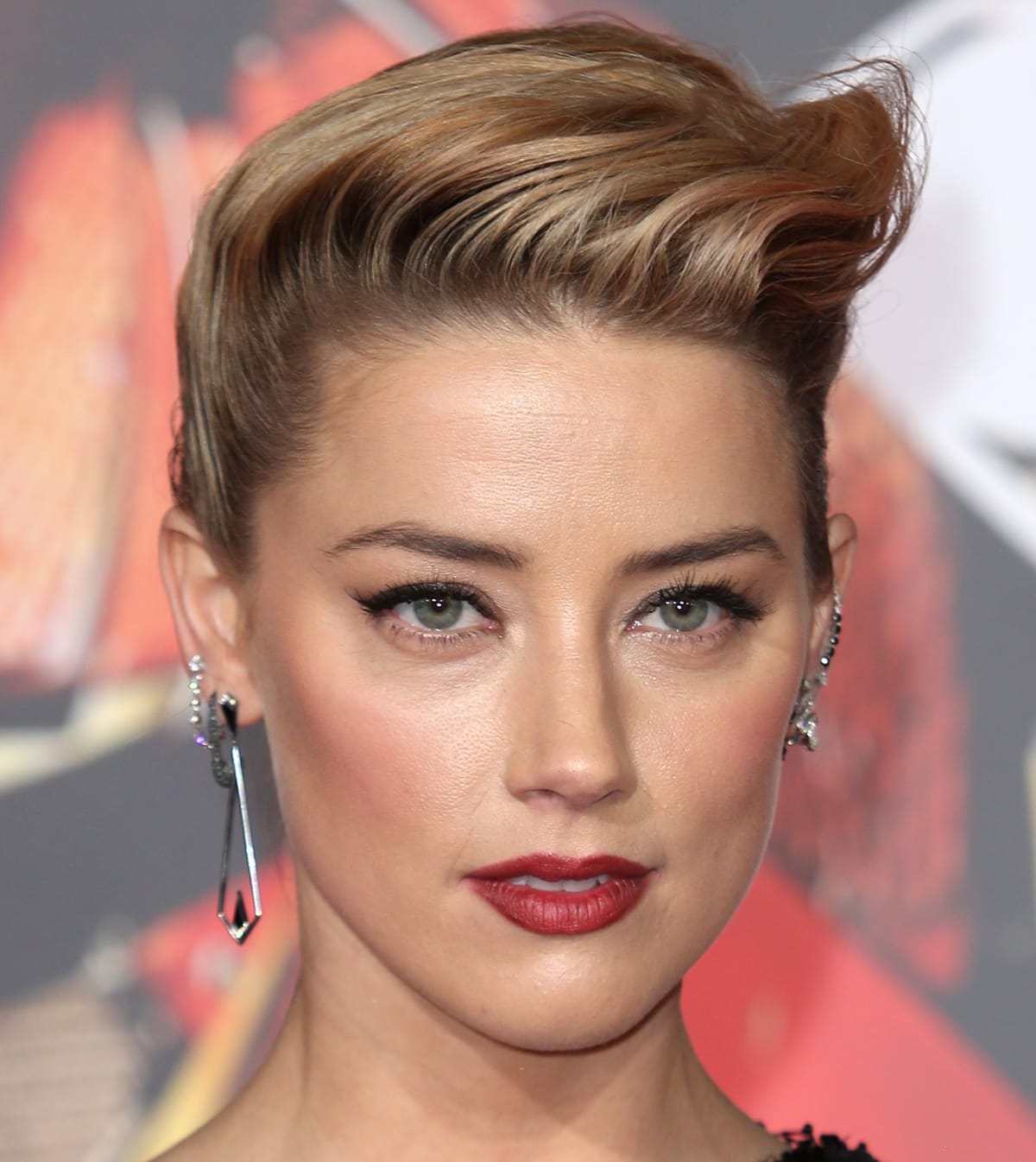 Amber Heard stuns in statement Eva Fehren earrings featuring a sleek geometric design