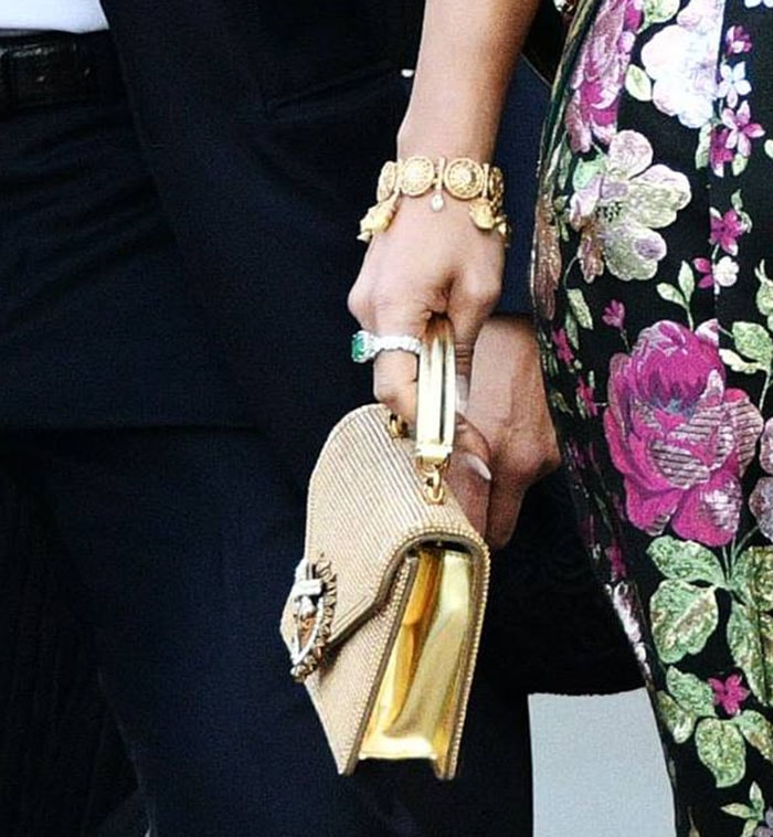 Jennifer Lopez carries a gold crystal-embellished Dolce Gabbana mini Devotion bag