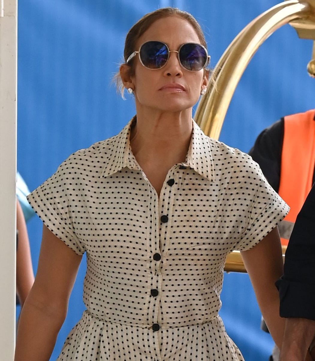 Jennifer Lopez styles her look with Jimmy Choo sunglasses and a low casual bun