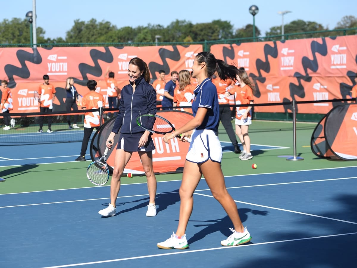 Joined by Emma Raducanu, Kate Middleton played tennis in a pique skort and polo shirt by Poivre Blanc and white court-tech street On The Roger Centre Court sneakers
