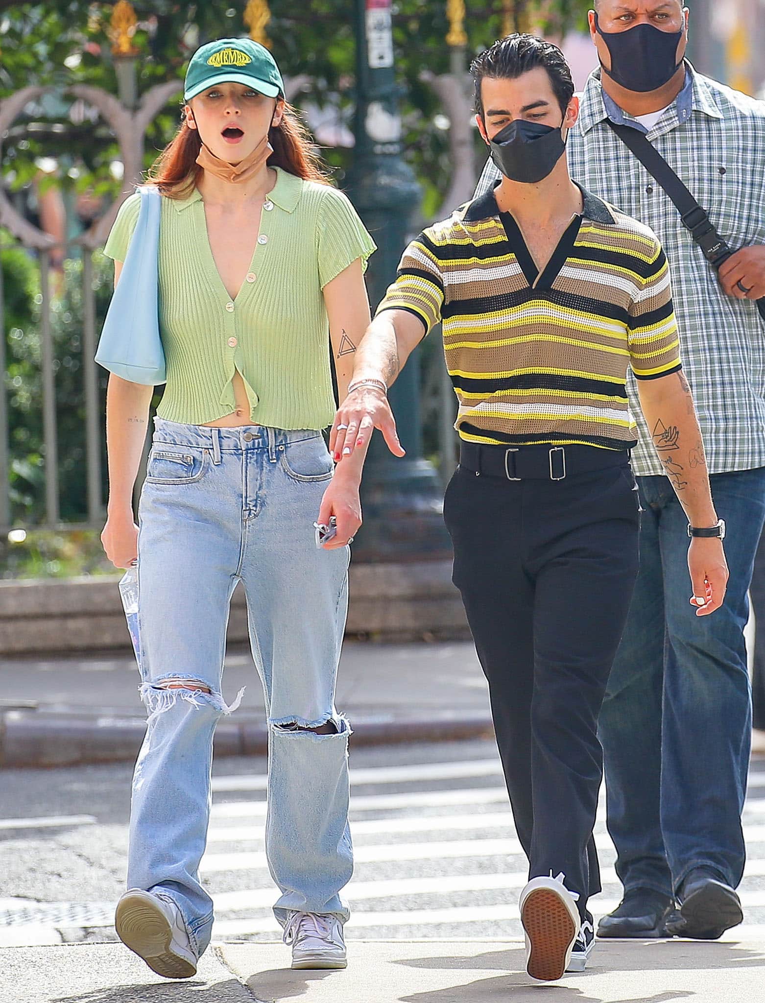 Sophie Turner and Joe Jonas serve coordinated casual-cool style in knitwear tops, ripped jeans, and retro sneakers while strolling through New York City on September 21, 2021