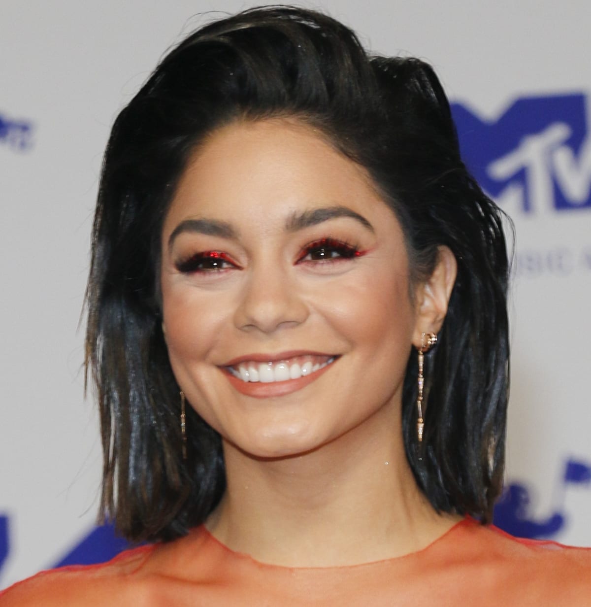 Vanessa Hudgens glows on the red carpet, wearing Eva Fehren's five fringe drop earrings—elegant, edgy, and perfectly complementing her bold makeup and sleek hairstyle