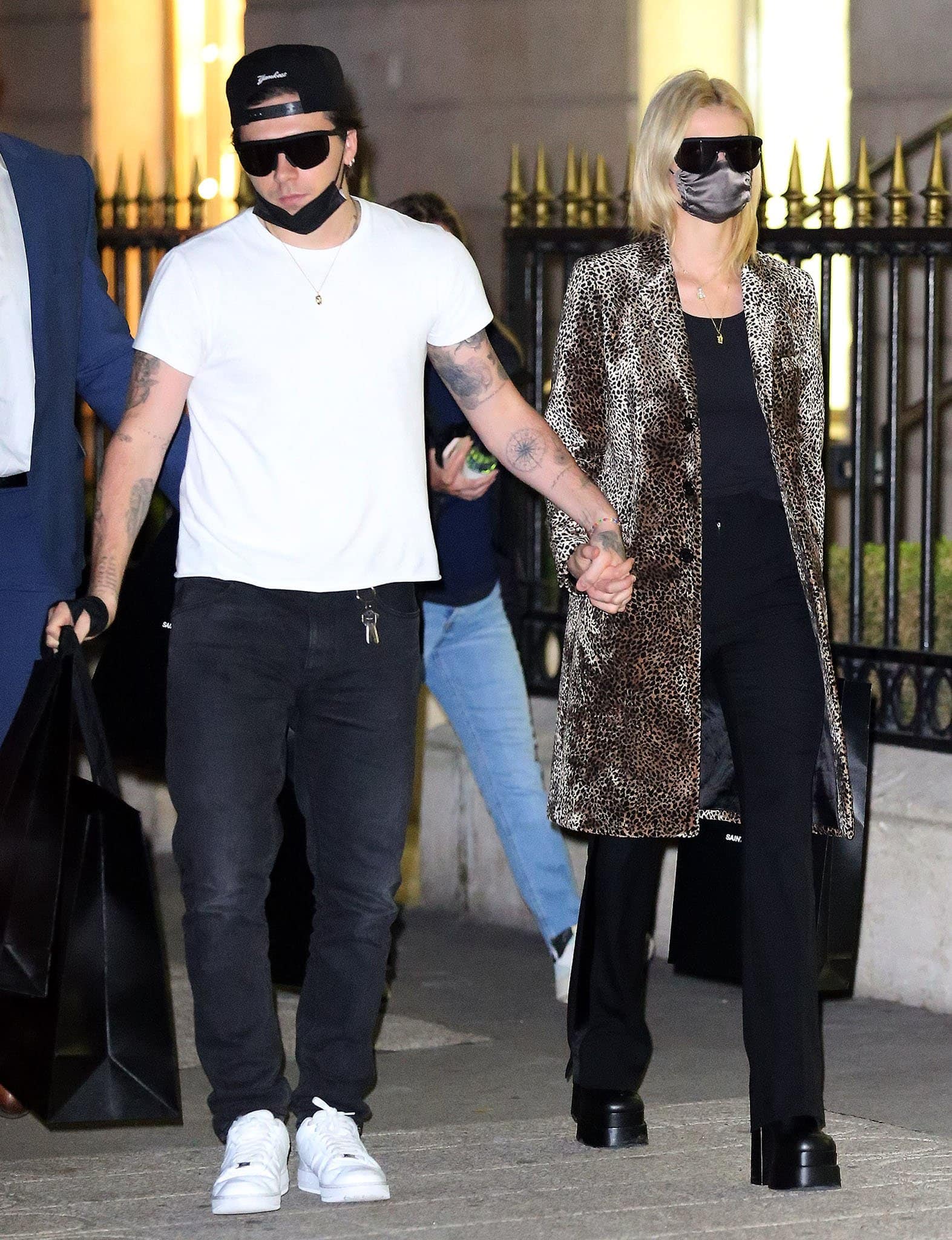 Brooklyn Beckham and Nicola Peltz step out on Avenue Montaigne in Paris, with Nicola pairing a leopard-print coat and black separates with towering Versace platform boots