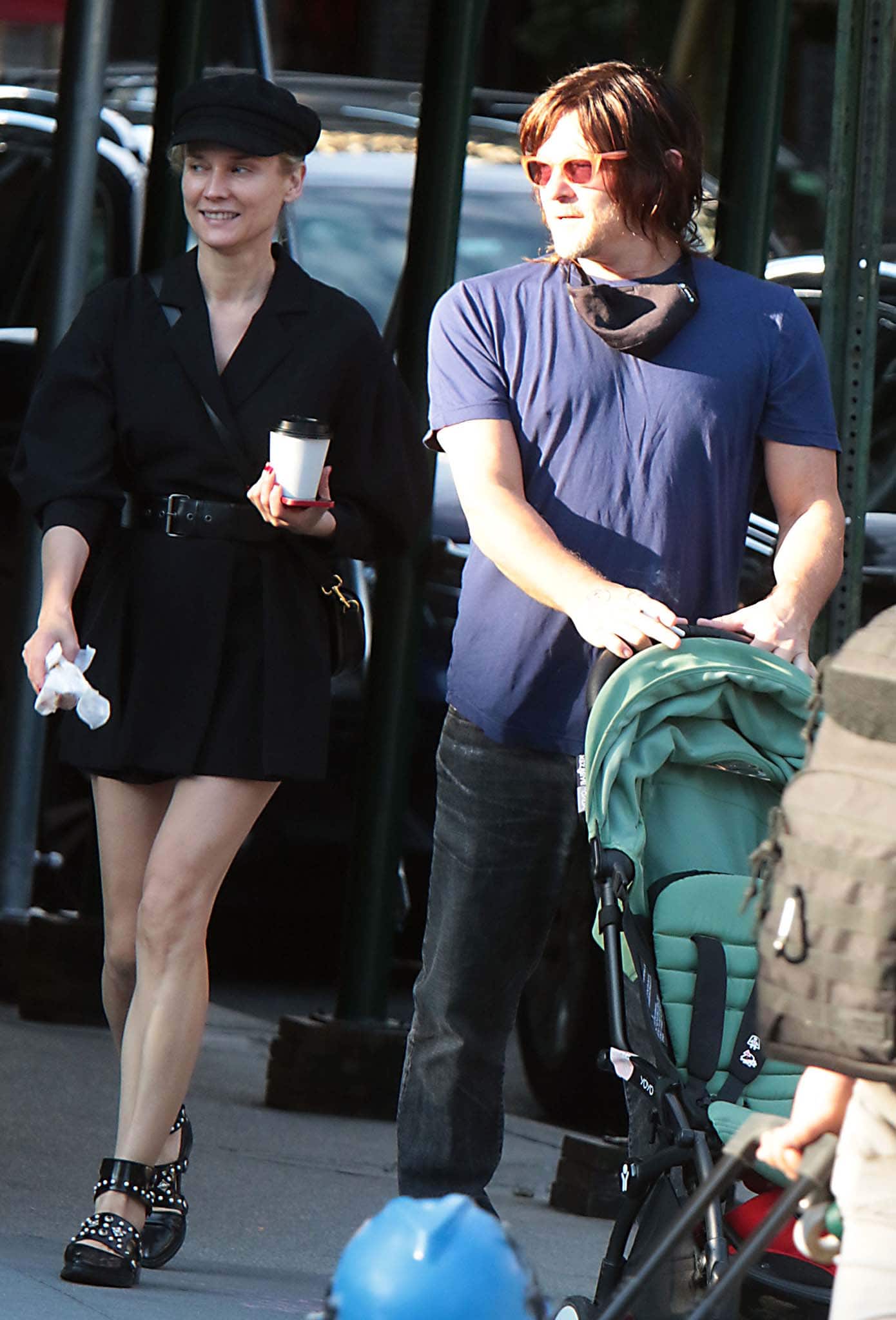 Diane Kruger and Norman Reedus run errands in Soho on October 15, 2021, with Kruger elevating her minimalist black mini dress using studded flat shoes that add a sharp, street-style edge to her off-duty look