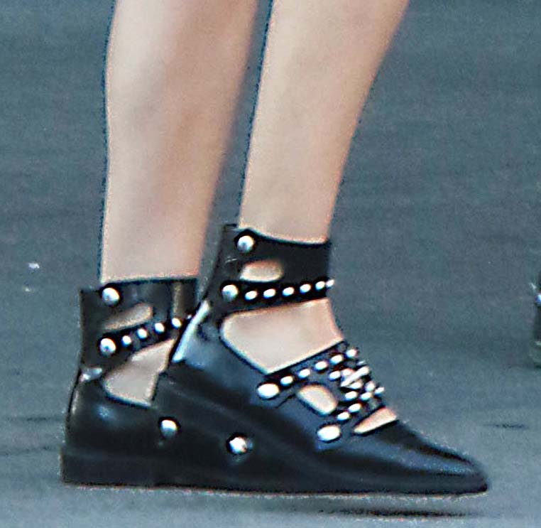 Diane Kruger grounds her Soho street look with Toga Pulla’s studded leather flats, letting the brand’s signature hardware add an edgy contrast to her otherwise minimalist outfit