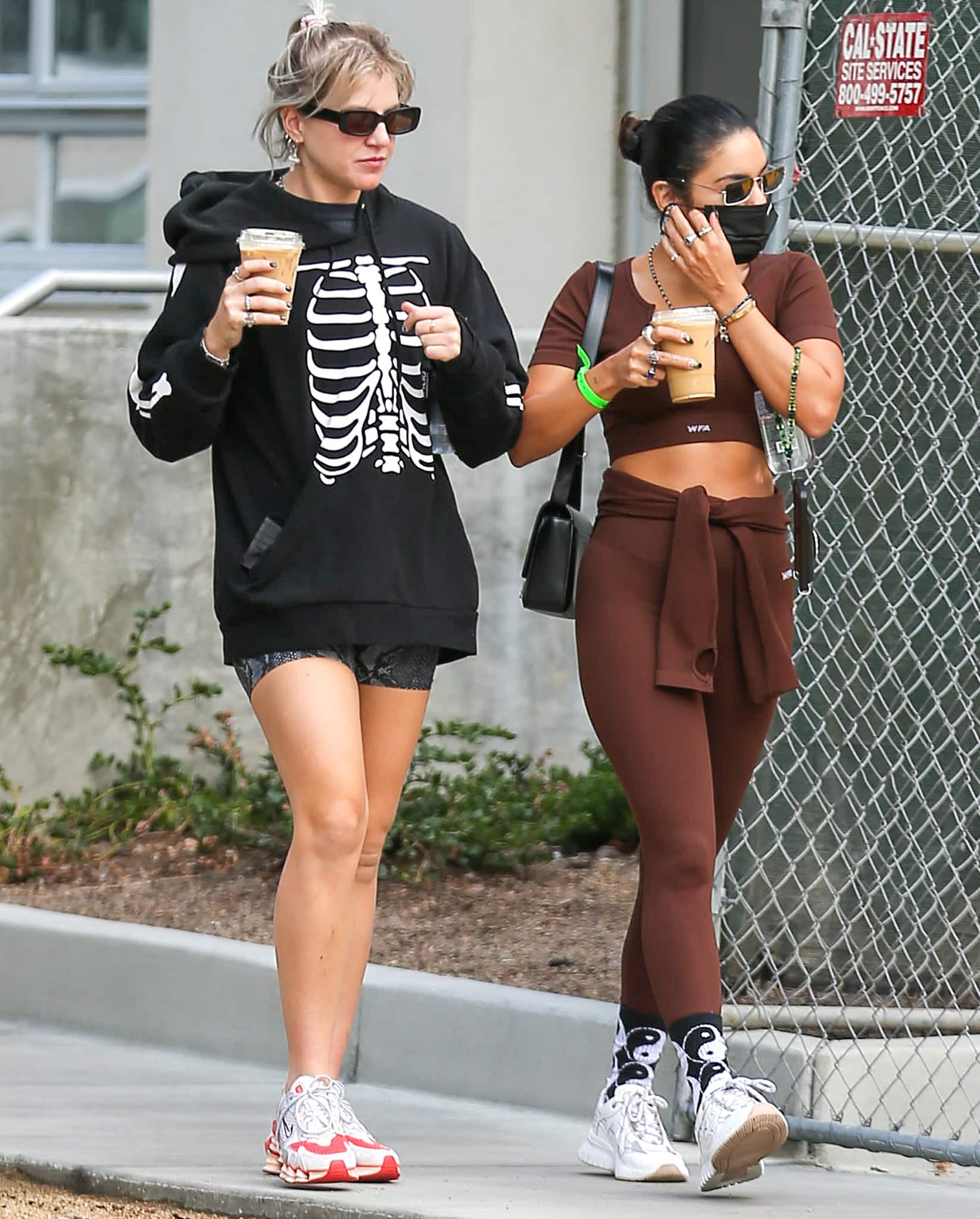 Best friends GG Magree and Vanessa Hudgens step out after a workout in Los Angeles on October 11, 2021, mixing sporty staples as Magree opts for chunky Nike sneakers while Hudgens sticks to her go-to white Mercer Amsterdam “Jupiter” trainers