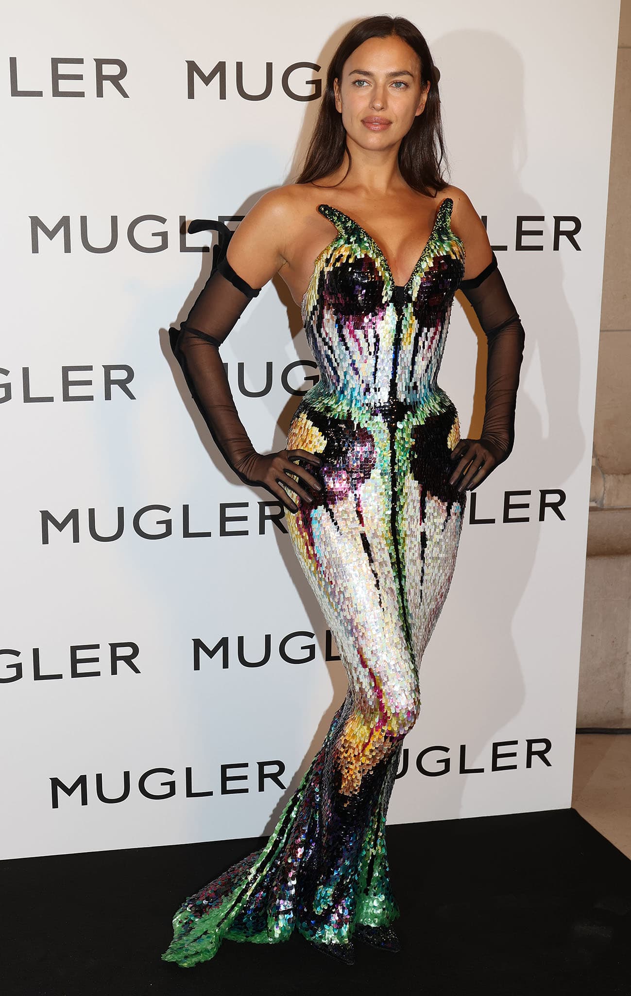 Irina Shayk wearing Thierry Mugler's legendary Les Insectes Spring/Summer 1997 Haute Couture butterfly gown, styled with sheer opera gloves and embellished pointed-toe pumps that complemented the shimmering, hand-sequined masterpiece