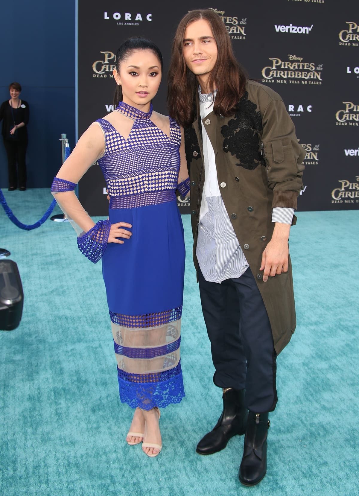 Lana Condor pairs her cobalt blue cutout dress with nude ankle-strap heels to elongate her petite frame as she arrives with Anthony De La Torre at the Pirates of the Caribbean: Dead Men Tell No Tales premiere on May 18, 2017
