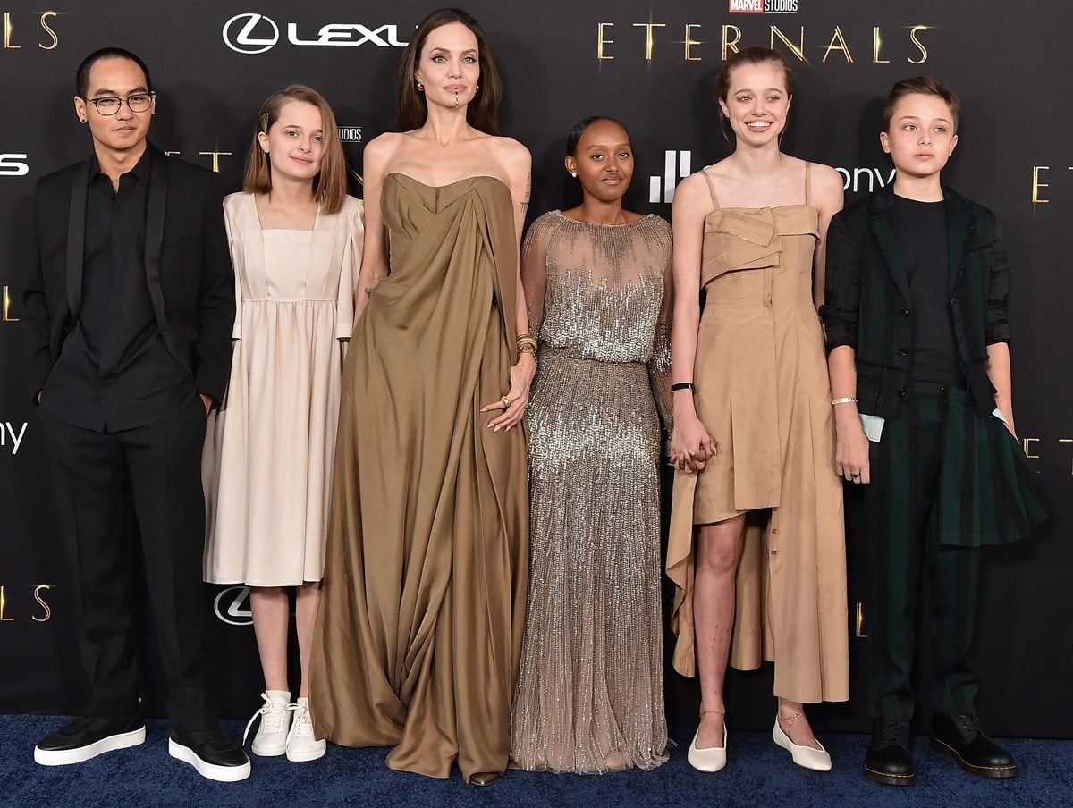 Angelina Jolie and her children — Maddox, Vivienne, Zahara, Shiloh, and Knox Jolie-Pitt — make a rare coordinated appearance at the Eternals Los Angeles premiere, blending couture elegance with youthful individuality