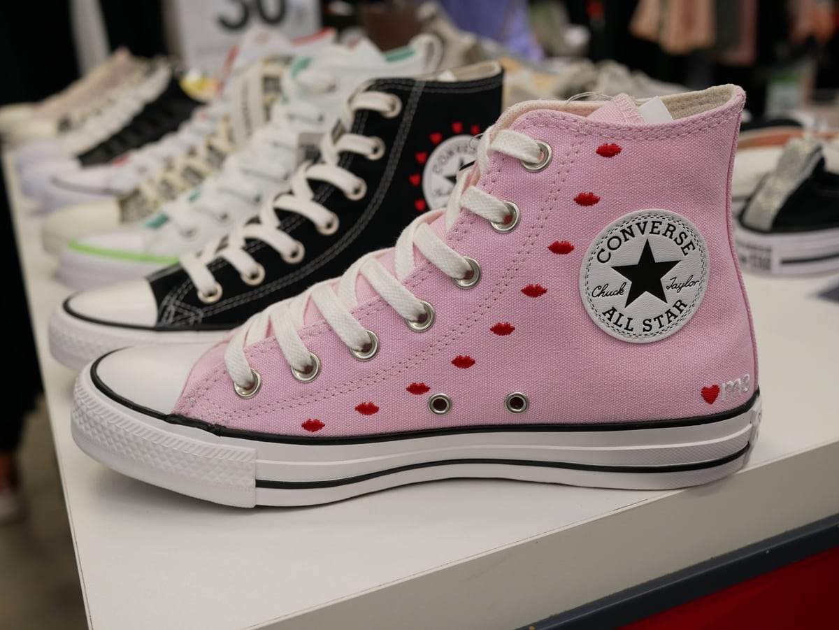 The pink Converse Chuck Taylor All Star high-top, featuring embroidered red hearts — a playful twist on the brand’s most iconic silhouette