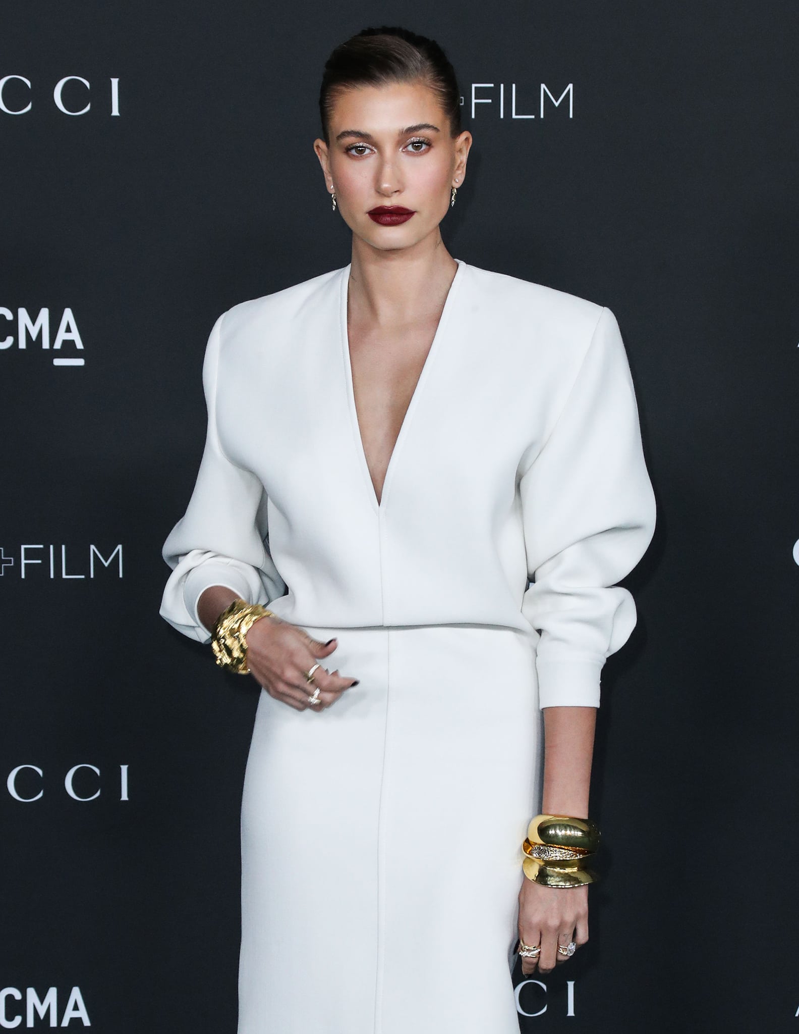 Gold Tiffany Co. jewelry added warmth and texture to Hailey Bieber’s monochromatic Saint Laurent ensemble at the LACMA Art + Film Gala