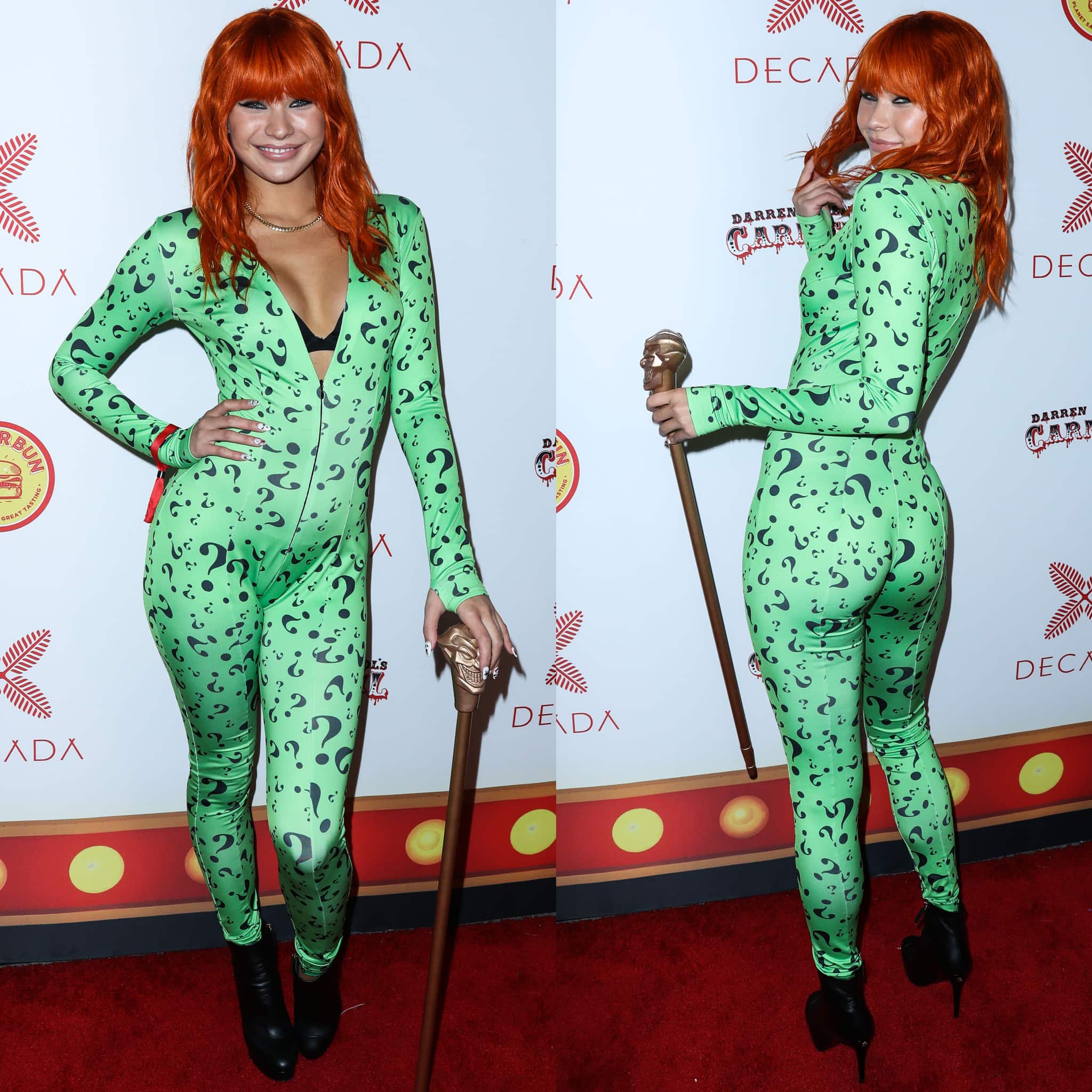 Josie Canseco channels the Riddler in a curve-hugging green question-mark jumpsuit, accessorizing with a sculpted cane and finishing the villain-inspired look with sleek black pointed-toe ankle boots that add sharp polish to the comic-book ensemble