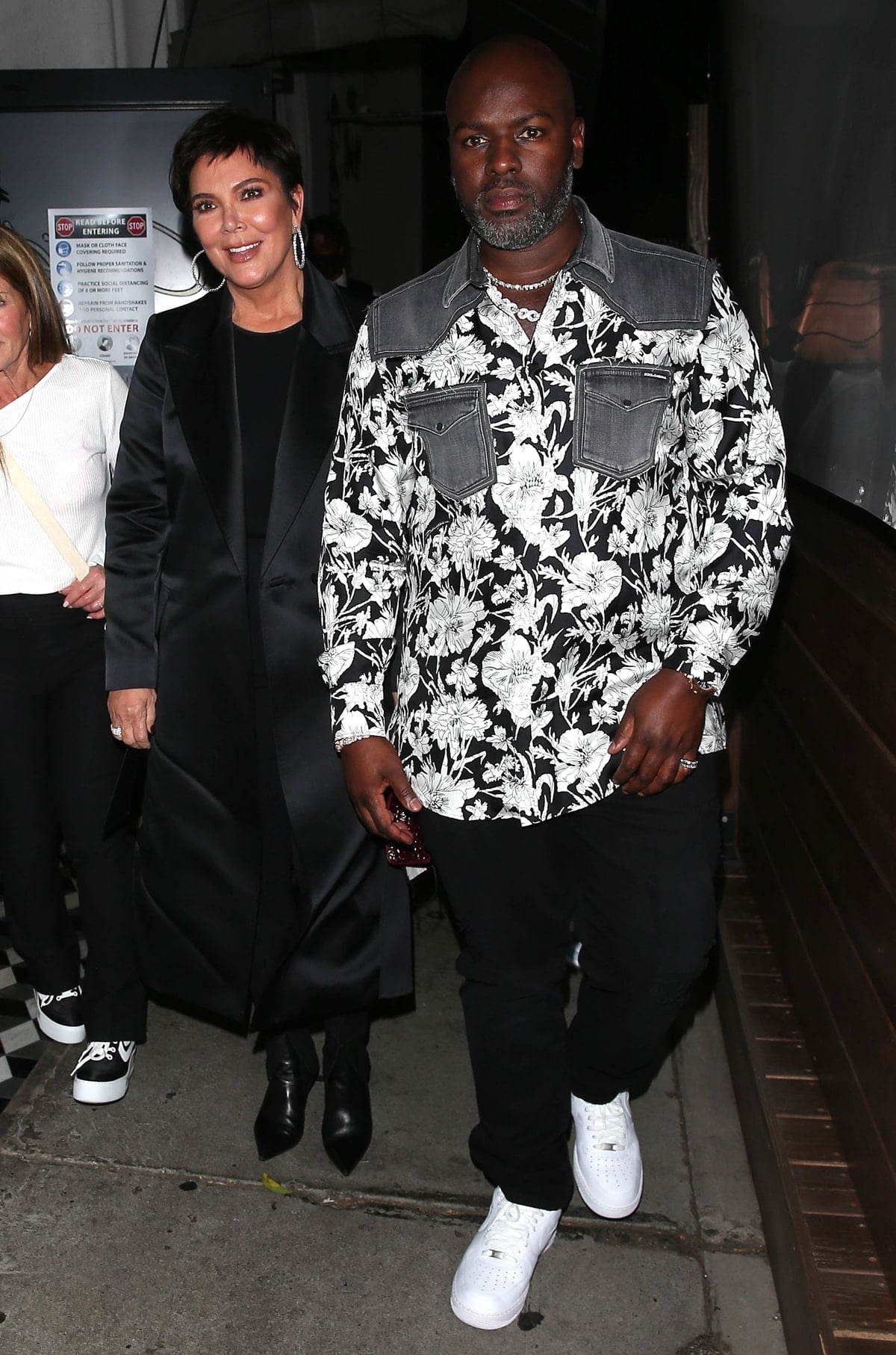Kris Jenner keeps things sleek in an all-black ensemble with pointed leather ankle boots as she leaves Craig’s Restaurant in West Hollywood with Corey Gamble on September 14, 2021