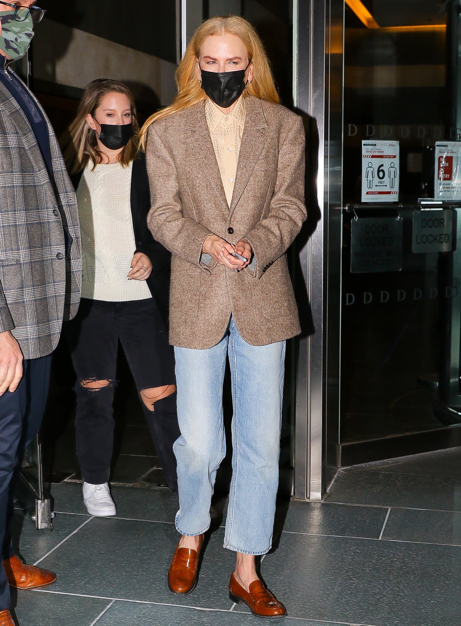 Nicole Kidman wears a grandpa-style outfit with brown blazer, straight-leg jeans, and cognac brown loafers at the post-screening QA of Being the Ricardos in New York City on November 17, 2021