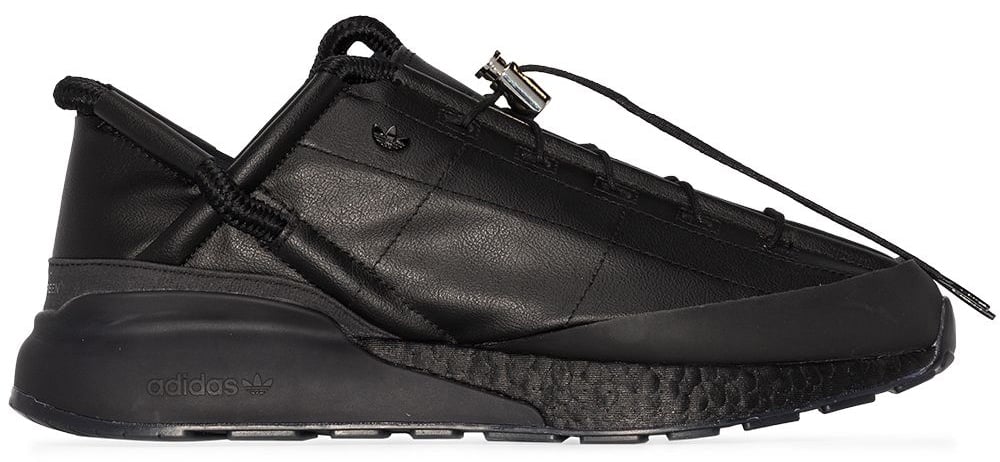 The Adidas x Craig Green ZX 2K Phormar II is crafted from supple faux leather with strategically placed stitching that allows the upper to collapse for easy storage, finished with a cushioned Boost midsole and a streamlined, all-black silhouette that leans more architectural than athletic