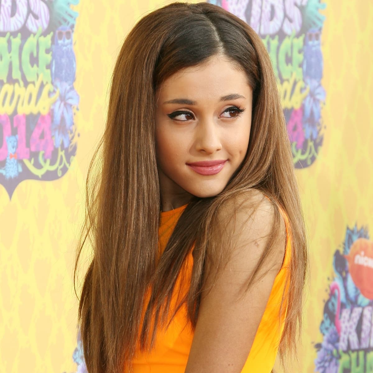 Ariana Grande glowed in a bright orange mini dress at the 2014 Kids’ Choice Awards