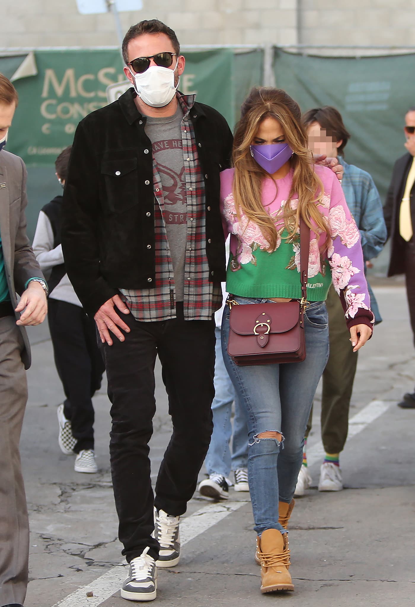 Ben Affleck and Jennifer Lopez bring their blended family to see Licorice Pizza at the Regency Village Theatre in Westwood on December 4, 2021, with Lopez grounding her floral Valentino sweater and ripped skinny jeans in crystal-covered Timberland x Jimmy Choo boots