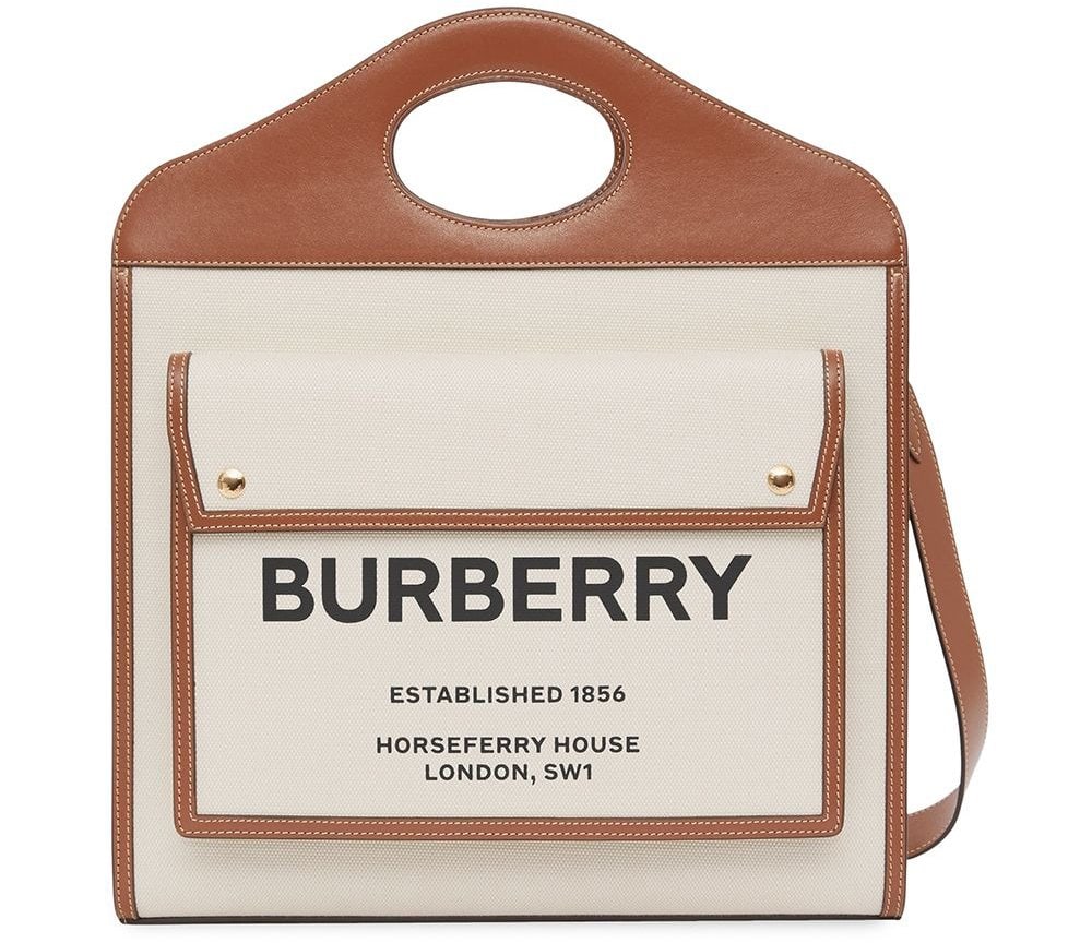 Perfect for all out and about adventures, this medium two-tone Pocket bag features a front logo print, an adjustable detachable shoulder strap, and a cutout top handle
