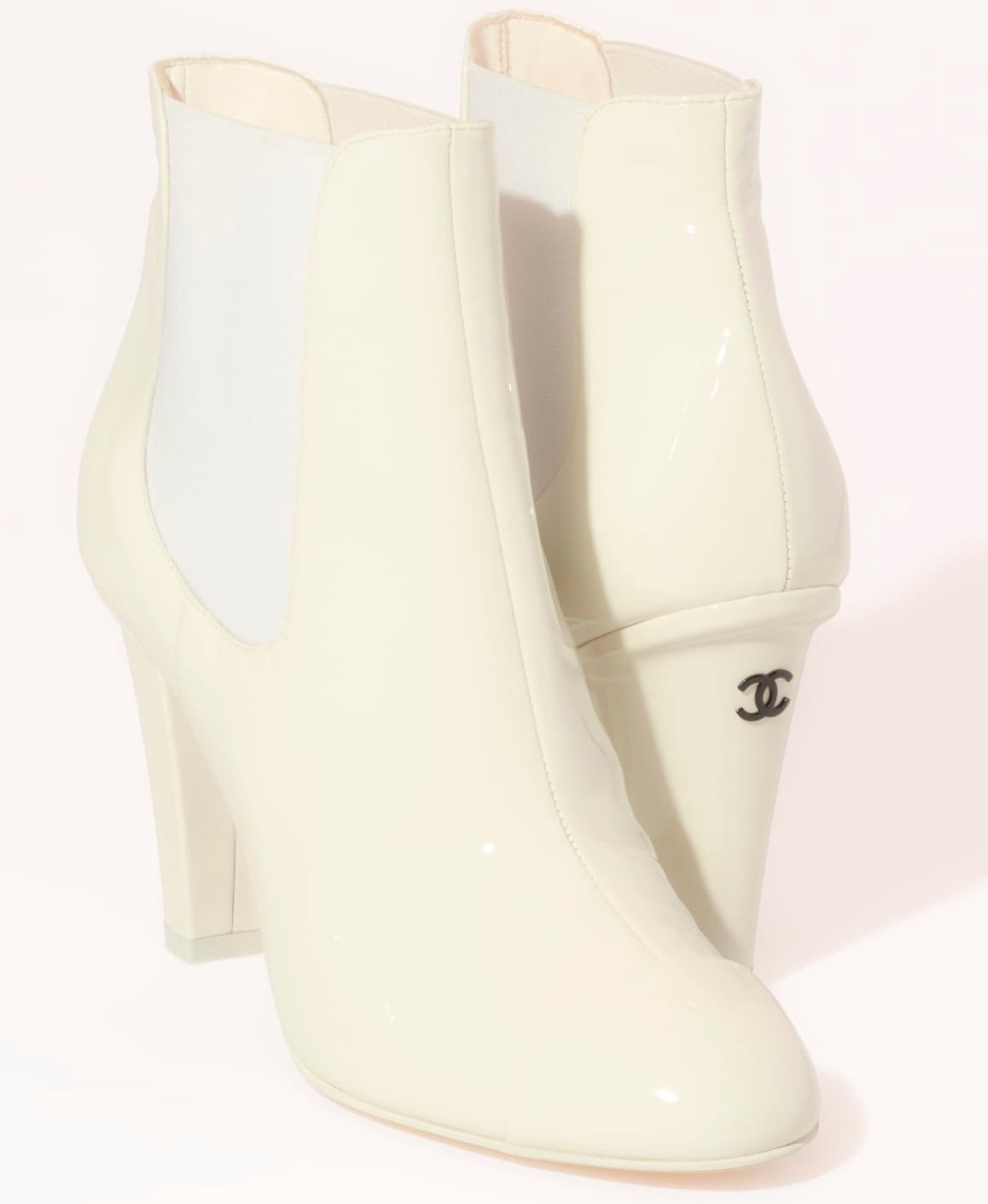 These Chanel ankle boots feature Chelsea-style elastic panels and angled heels accented with double C logo