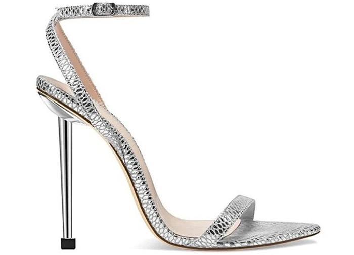 The Femme Ford sandal features snake-effect silver straps and 4.5-inch stiletto heels