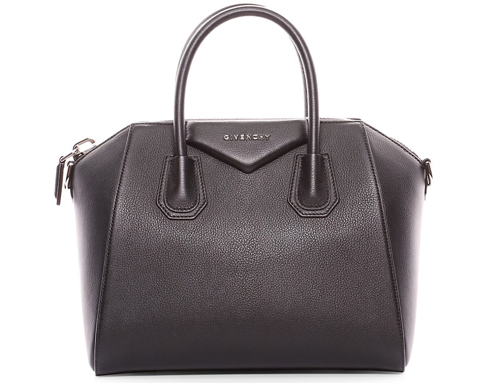 A convertible structured satchel that has a top zip closure, double top handles, and a removable shoulder strap