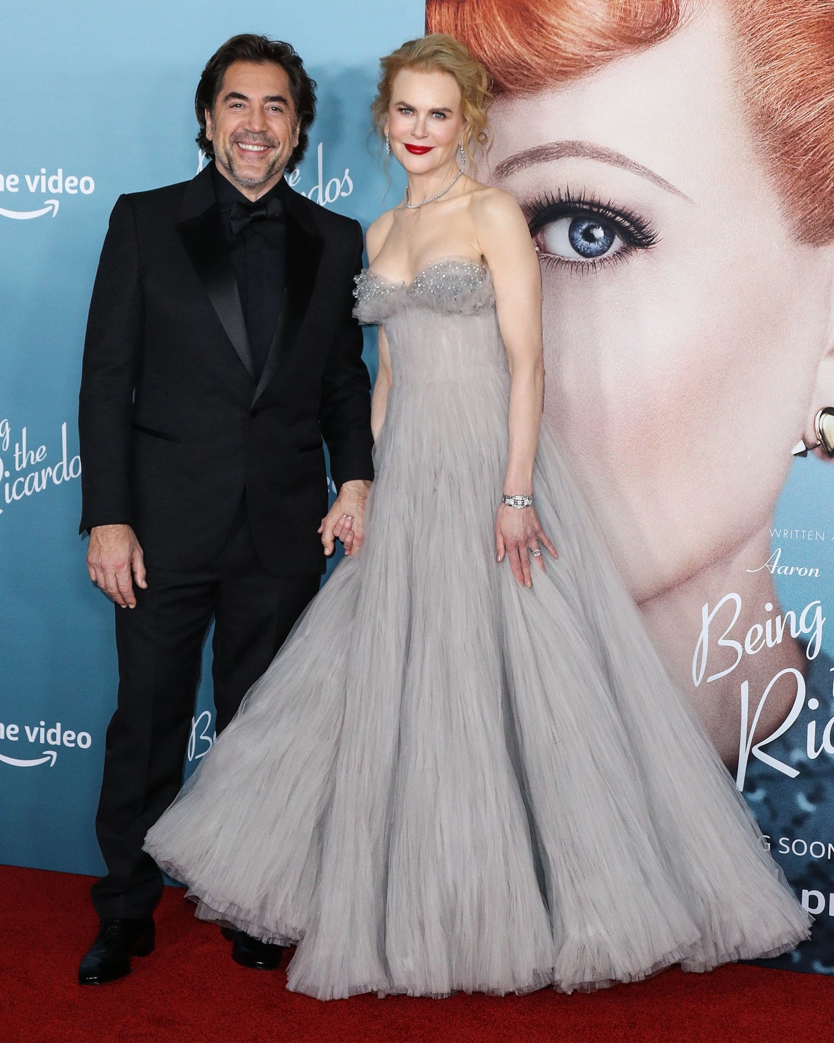 Nicole Kidman appeared nearly the same height as her 5’11” co-star Javier Bardem while posing together at the Being the Ricardos premiere, with her crystal-embellished Jimmy Choo “Thyra” heels adding extra lift beneath the voluminous Armani Privé couture gown