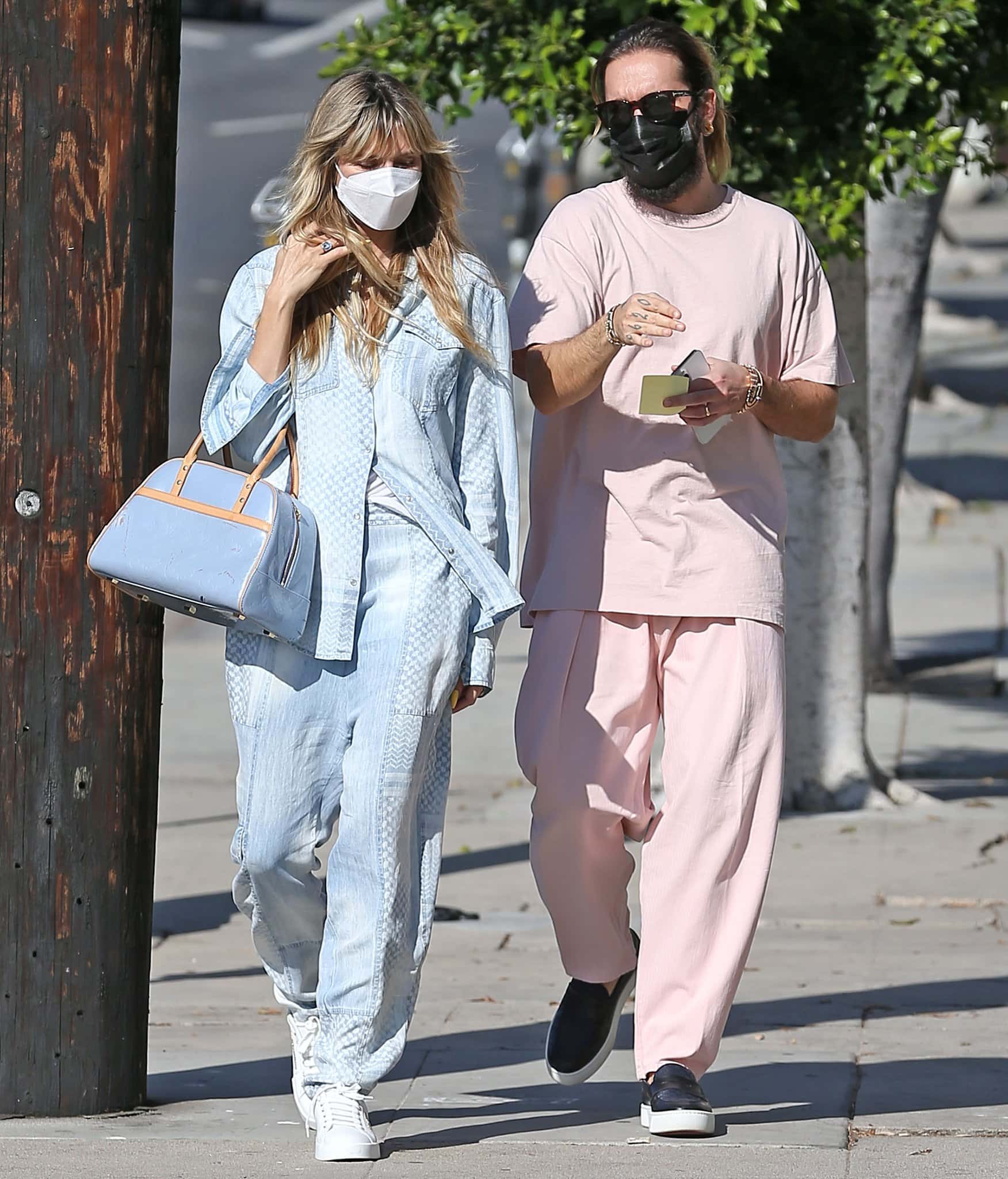 Heidi Klum and Tom Kaulitz embraced contrasting palettes while shopping in Los Angeles, with her pale-blue Lala Berlin set balancing his head-to-toe blush look