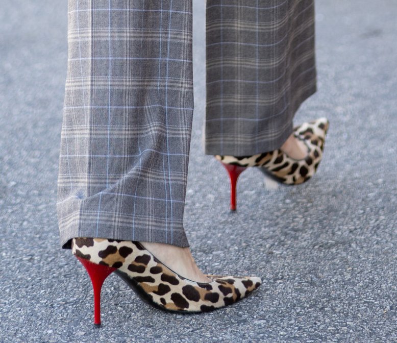 Leopard-print pointed-toe pumps with sculpted bright-red heels become the standout finish to Heidi Klum's fearless mix of patterns