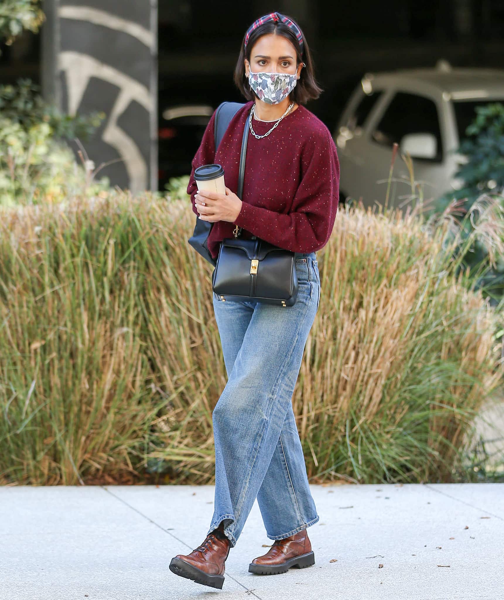 Jessica Alba steps out in Los Angeles on December 15, 2021, pairing a speckled maroon sweater and relaxed denim with brown croc-embossed Freda Salvador “Emi” lace-up boots, grounding her off-duty look with rugged polish