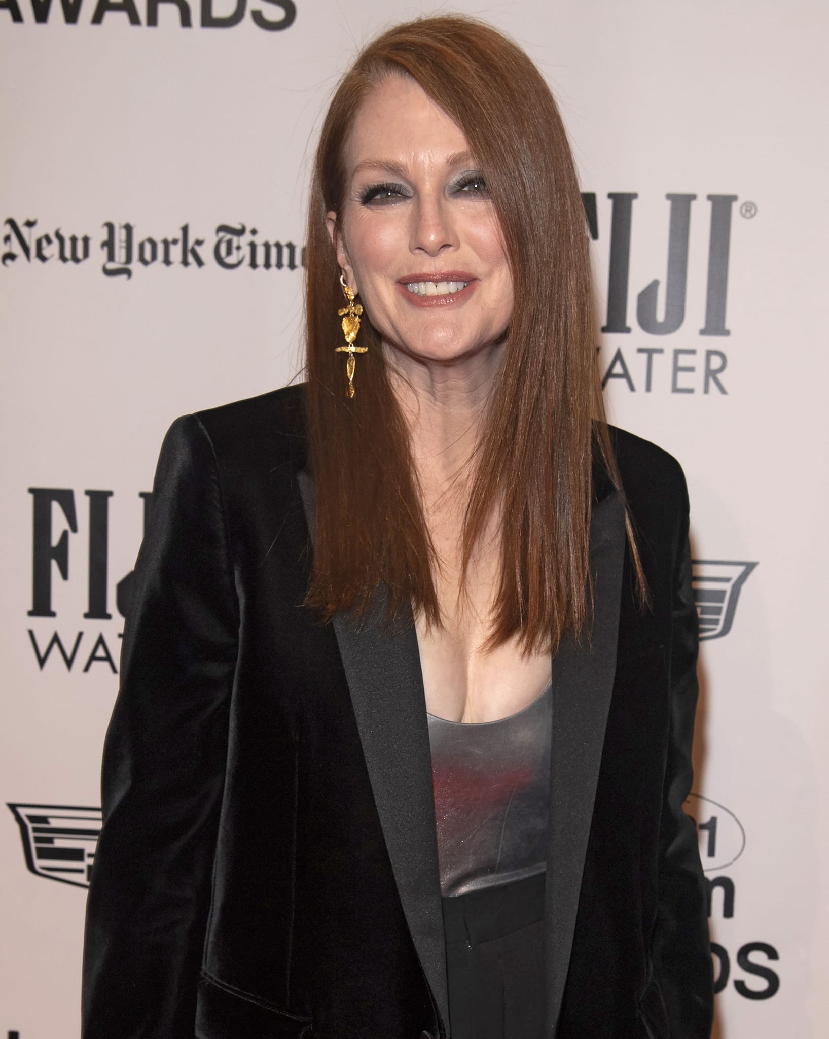 Julianne Moore wears her signature red hair sleek and straight with smoky eye makeup and bold Lisa Eisner gold nugget totem earrings at the 2021 Gotham Awards