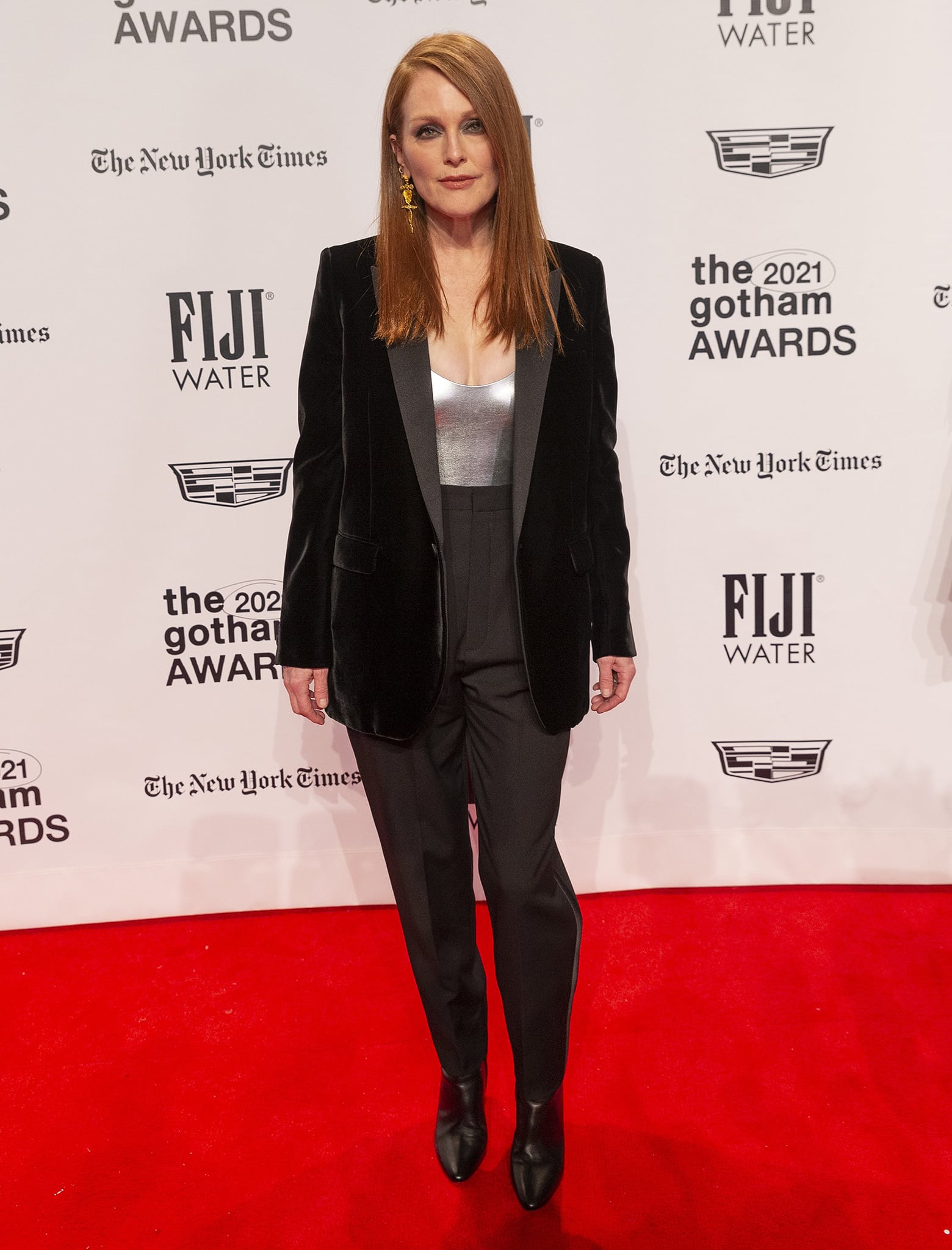 Julianne Moore brings tailored glamour to the 2021 Gotham Awards in a Saint Laurent black velvet blazer, metallic silver corset top, and sleek trousers paired with black boots