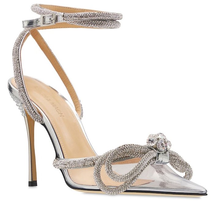 The Mach Mach pumps boast silver straps with microcrystal embellishments and a double bow design on the PVC pointed toes