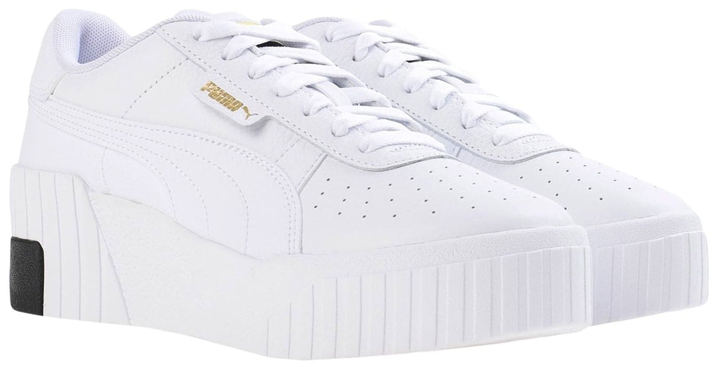 Puma’s white Cali Wedge updates the brand’s classic low-top styling with a perforated leather toe, signature Formstrip, and exaggerated wedge sole