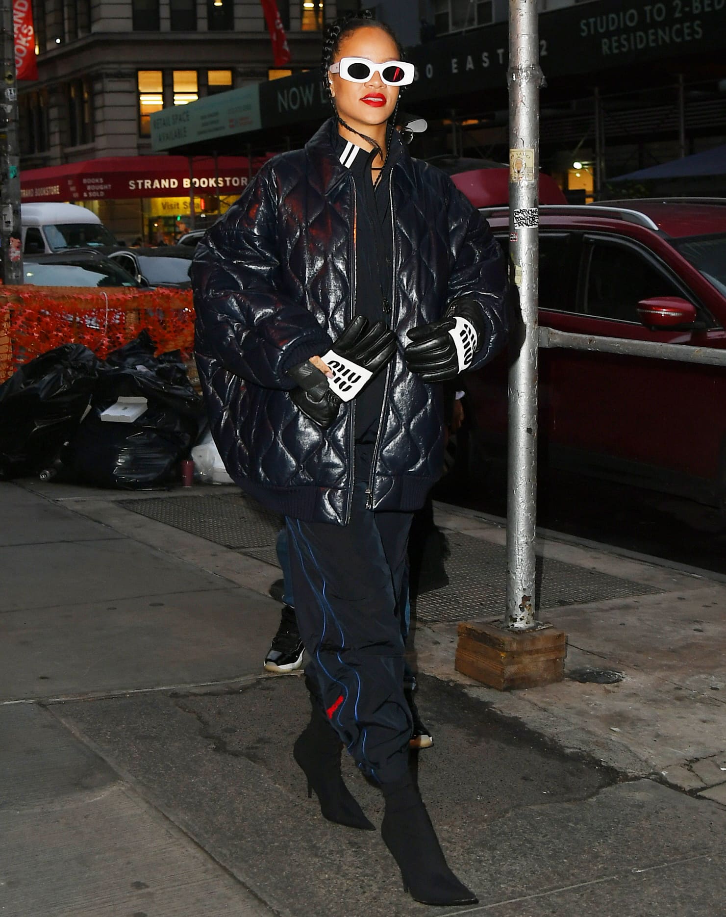 Rihanna steps out in SoHo on December 2, 2021, sharpening her layered streetwear look with sleek pointed Balenciaga Knife boots during a shopping outing