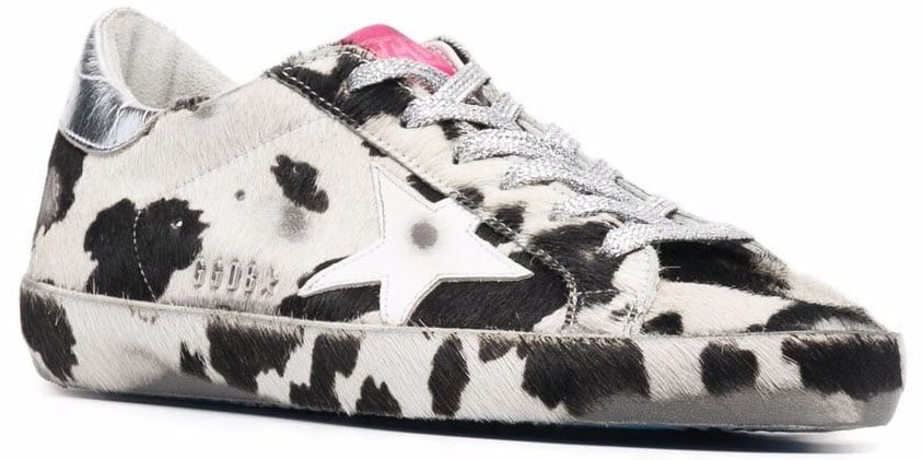 Pair these cow-printed sneakers with solid-color athleisure for a cool and chic street style