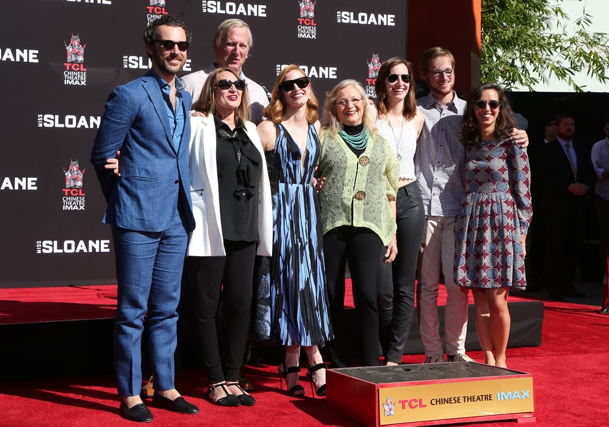 Gian Luca Passi de Preposulo, Jerri Chastain, Michael Hastey, actress/honoree Jessica Chastain, Marilyn Herst, Laci Smoot, and Daniel Hastey pose for a photo at Jessica Chastain's Hand and Footprint Ceremony
