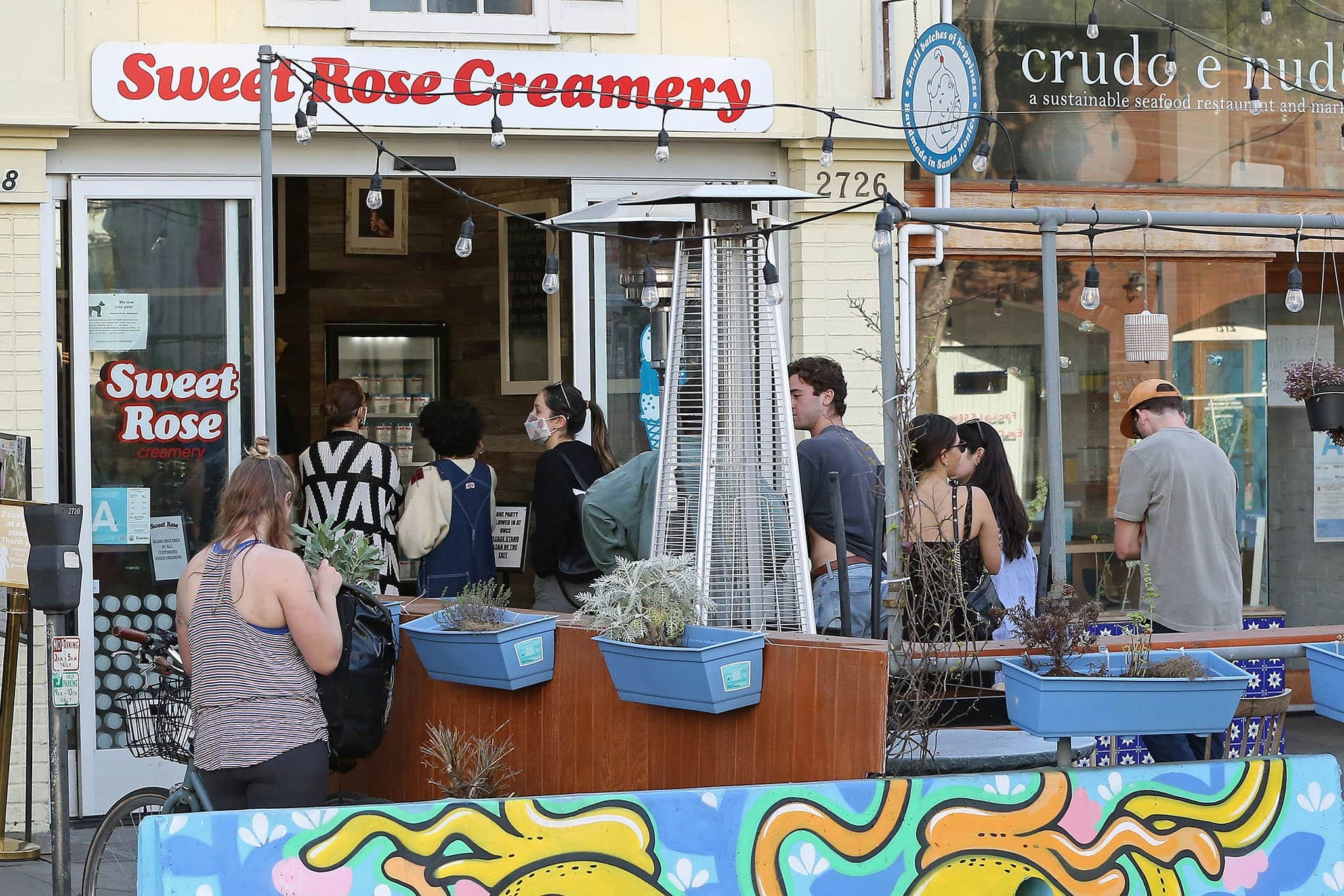 Jennifer Lopez and her daughter Emme line up outside Sweet Rose Creamery in Santa Monica on January 16, 2022, blending relaxed California weekend style with layered winter dressing