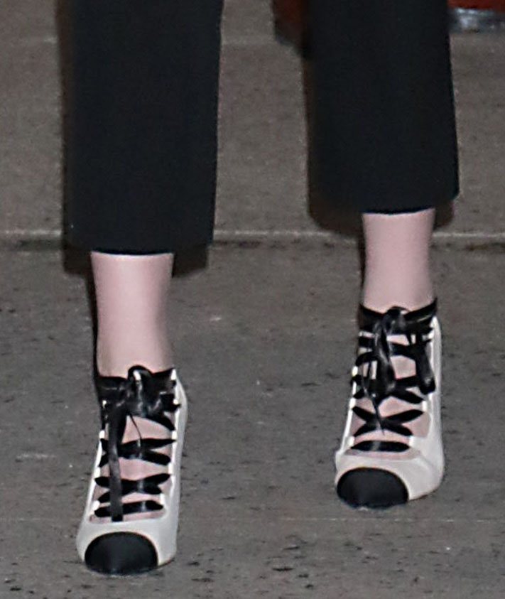 Kristen Stewart completes her monochrome Chanel look with black-and-cream lace-up cap-toe pumps