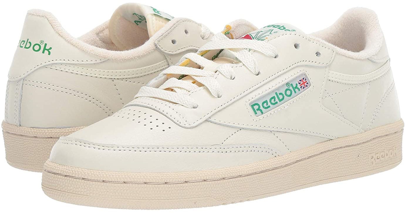 A tennis-style pair of Reebok Club C 85 kicks made of leather with perforations, EVA midsoles, and rubber outsoles